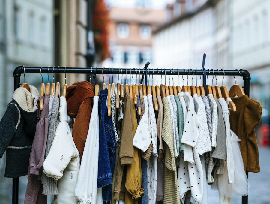 Neatly hung shirts, jackets and knits on a clothing rail