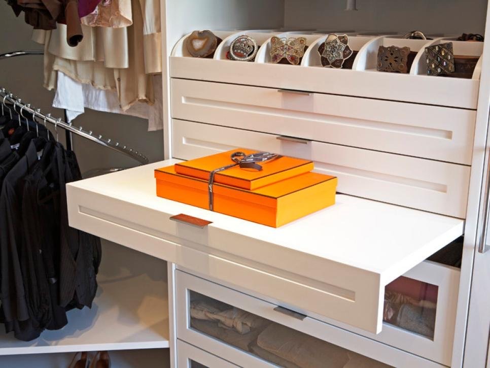 Neatly organized closet drawers and shelving
