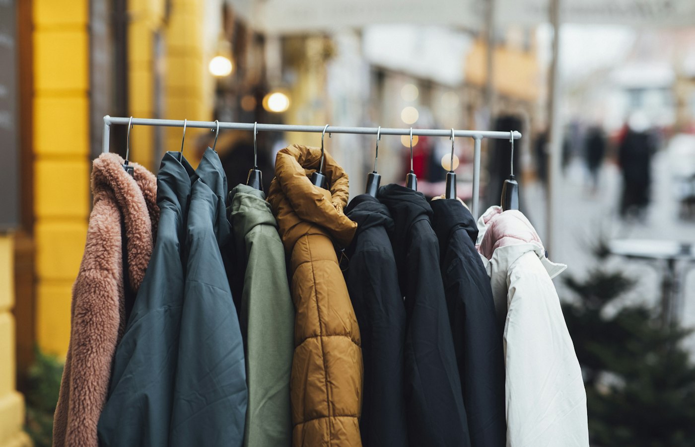 A rail of coats and jackets outside a shop