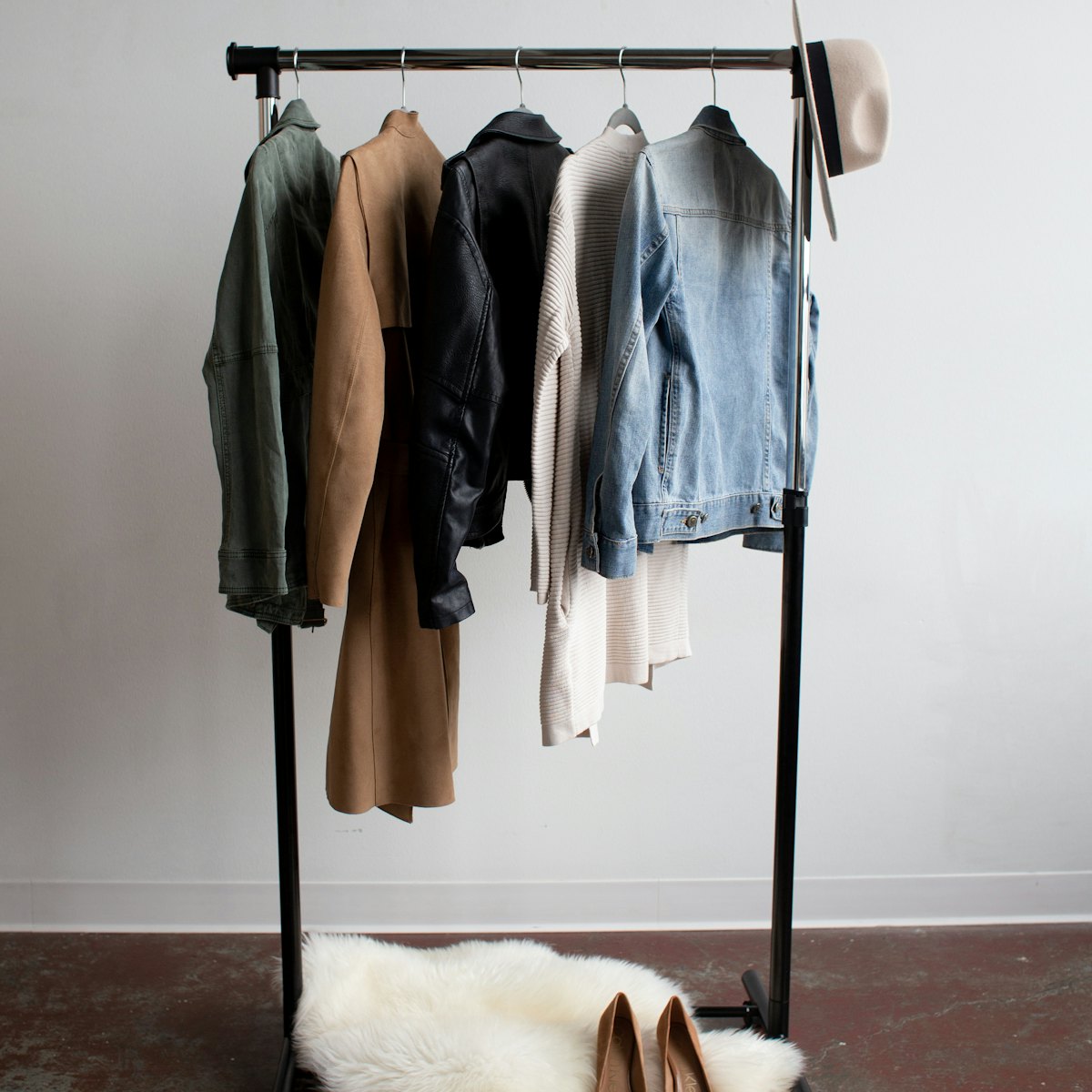 A clothing rail of jackets in a bright studio